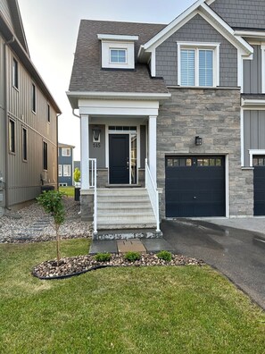 Professionally landscaped property with two-car driveway