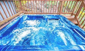 Soak up and relax in the hot tub while enjoying the scenery