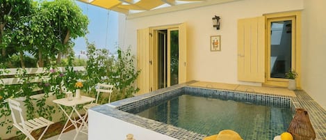 Experience the exterior, featuring a private jacuzzi for a luxurious and relaxing retreat