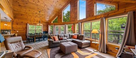 Open great room with beautiful knotty pine ceilings and great views for relaxing