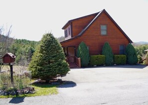 Front of cabin; driveway with parking