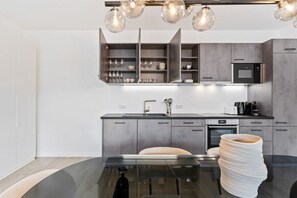 Reflect on your stay with style in this spacious and well-lit vanity area.