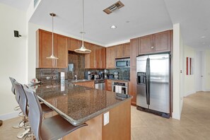 Full stocked kitchen with stainless steel appliances