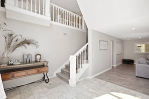 In the entry way, you'll see the stairs and the wlakway to the main living room.