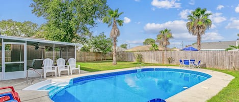 Huge private backyard complete with a private pool, screened porch, and plenty of yard for your dog