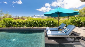 Lounge by the pool with a good book and a cold drink