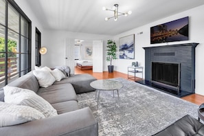 There is a bedroom off of the living room with a king size bed and Smart TV.
The fireplace is to not be utilized.