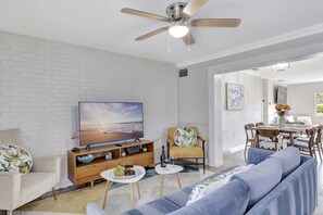 Our entertainment zone comes furnished with a Smart TV and a cozy couch for your relaxation and enjoyment.