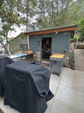 Outdoor cooking kitchen.  Grill, griddle outdoor freezer and refrigerator!