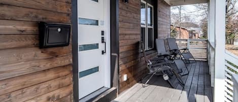 Front porch with seating to enjoy your morning cup of joe and a beautiful view.