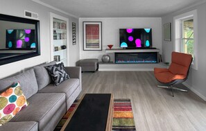 Ground floor den has "secret" bookcase door leading to laundry area