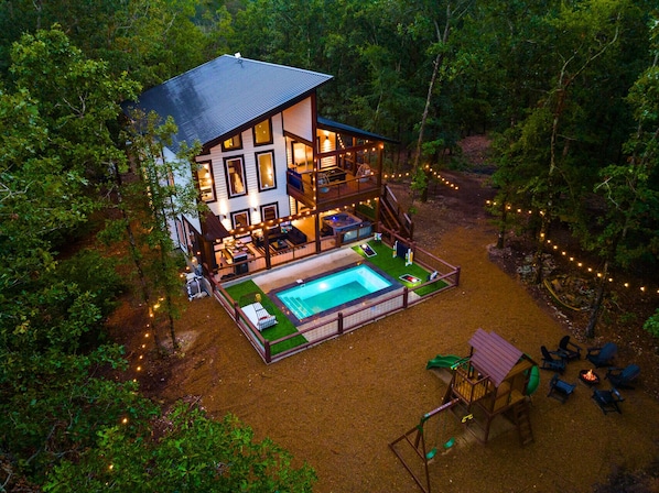 Welcome to White Lotus! Escape to this dreamy cabin, complete with a private pool, fire pit, and kids' play area—perfect for family fun and relaxation.
