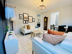 The living room has the dining table in this open area. 