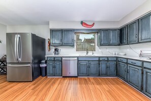 Fully equipped kitchen with stainless appliances — perfect for home-cooked meals.