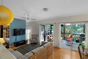 The office/playroom with bunk beds opens off the living room.