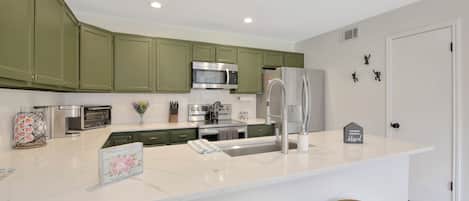 Gorgeous fully equipped kitchen, nice white quartz counter island, farm sink