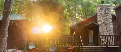 Bear Foot Lodge - a SkyRun Broken Bow Property - Experience a quiet sunrise morning in the backyard surrounded by the towering pine and hardwood trees.