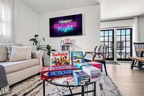 Game night ready! Board games and cozy vibes make this space perfect to relax.