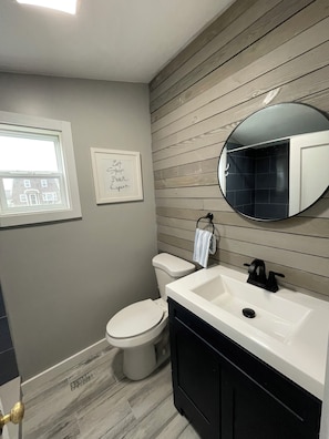 Newly renovated bathroom with high ceilings 
