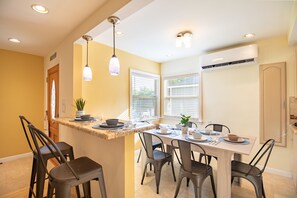 Kitchen table seats 6. Plus 2 more can be seated at the bar. 