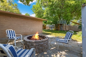 You may just love the back yard more than the house.  You have full use of the playhouse, tree fort and fire pit.  Or you can just lounge on the large covered patio and sip your tea or coffee and watch the squirrels play.