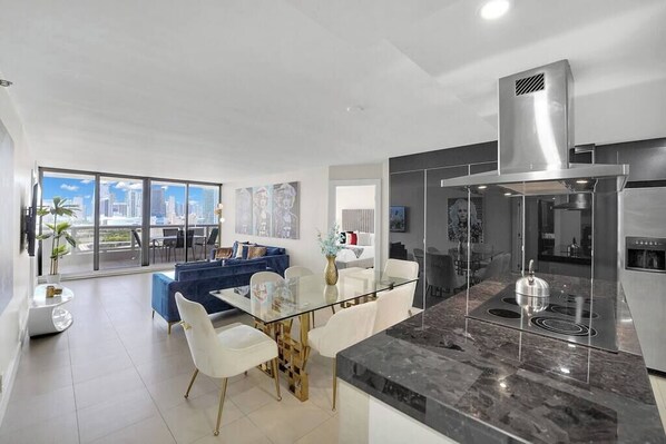 Fully equipped kitchen,Living area with Roku tv, balcony access
