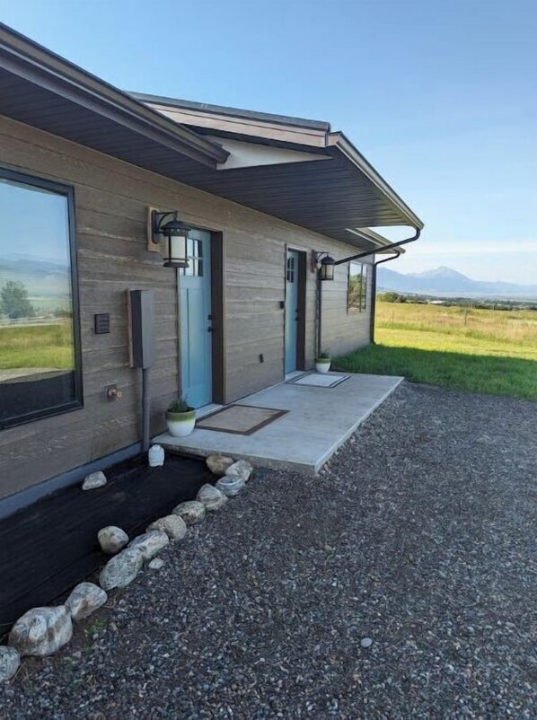 Front of the house.  One door is the front entry, the other to the laundry