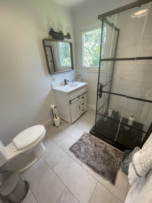 Brand new bathroom with barn door vanity.