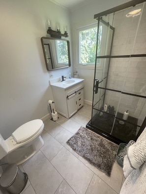Brand new bathroom with barn door vanity.