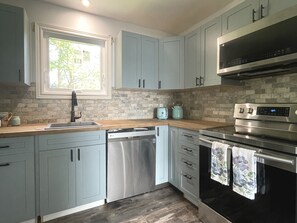 New dishwasher and butcher block countertop.