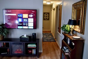 55 inch ROKU smart TV w/ electric fireplace. Can be used with or without heat. 