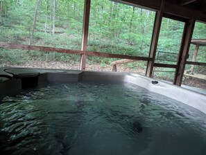 A forested view while soaking in your tub,