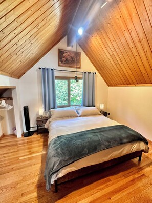 The whole upstairs is dedicated to the master bedroom with a king-size bed.