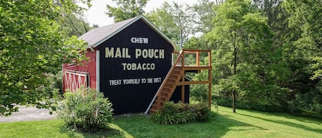 Mail Pouch Barn with cozy deck seating on the back!