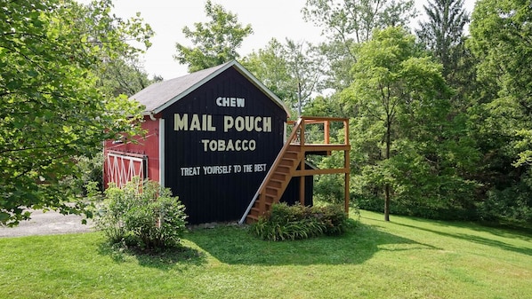 Mail Pouch Barn with cozy deck seating on the back!
