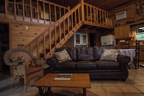 Living room and staircase to the loft.