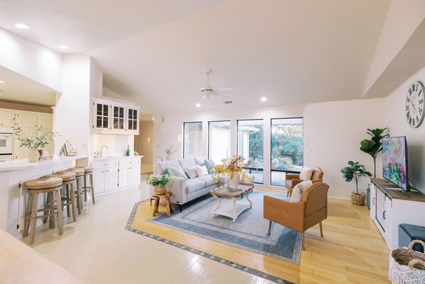 open concept family room with large windows