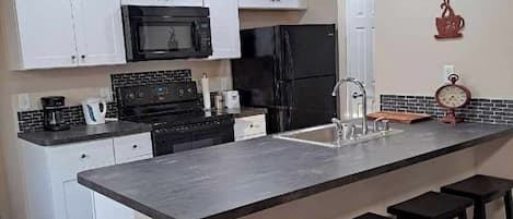 Full Kitchen with dishwasher and amenities. All you should need is food.