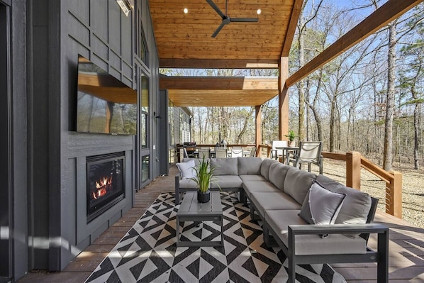 Outdoor seating with fireplace and tv