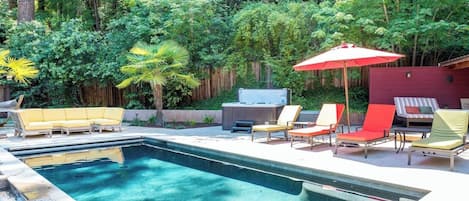 View of pool with loungers and umbrellas. Pool is closed unit May.