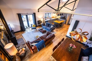 Living Space - has vaulted ceilings, exposed beams and a reclaimed timber wall.