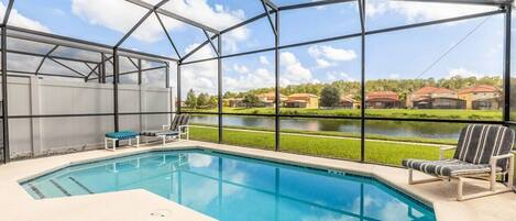 The home has a private enclosed patio w/pool and complete w/patio furniture