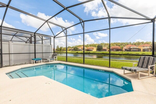 The home has a private enclosed patio w/pool and complete w/patio furniture