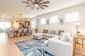 The main level sitting area is outfitted with a comfy sofa and a Smart TV with cable channels