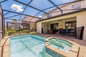 A beautiful private pool out back on the screened-in lanai, complete with sun loungers