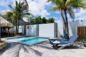 Amazing pool area of the villa in Noord, Aruba - Cosy beach chairs and neat and clean towels available - Beautiful view - Superbly designed pool area - Refreshing Environment - Vibrant Atmosphere