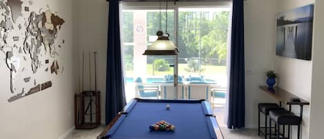 Pool table access to lanai for great entertainment