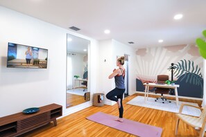 Yoga/Flex room with TV, full mirror, oak floors & great natural light.