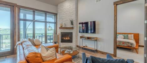 Beautiful, bright open concept living room with sleeper sofa.