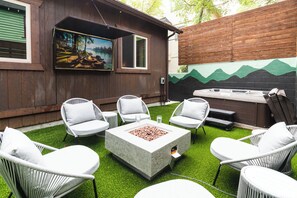 Enjoy the firepit or relax in the hot tub while watching a show.